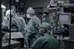 surgeons operating in theatre
