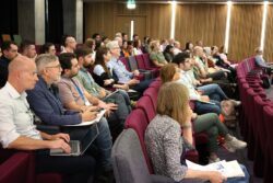 Delegates sat in lecture theatre listening to talks