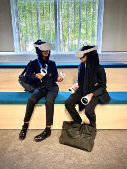 Two children playing with VR headsets