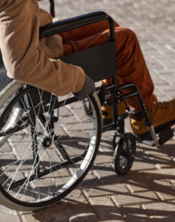 Person in wheelchair on pavement