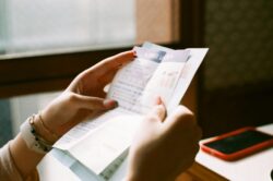 Hands holding an invoice