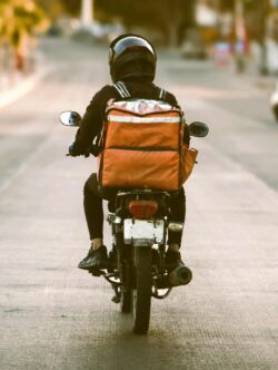 Food delivery driver on moped